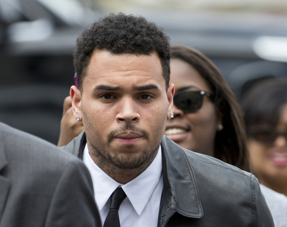 Chris Brown, seen arriving at the D.C. Superior Court in Washington on June 25, is linked to an assault case involving a fan that dates to October 2013.