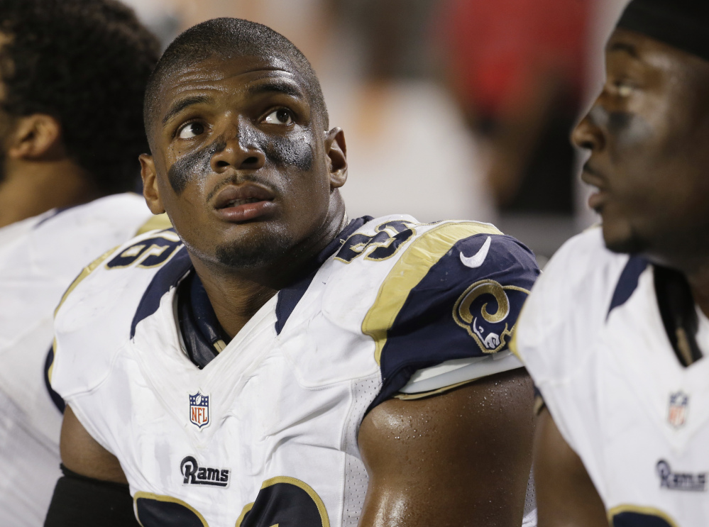 St. Louis Rams defensive end Michael Sam (96) looks up at the scoreboard from the sidelines during the first half of an NFL preseason game against the Miami Dolphins, Thursday.