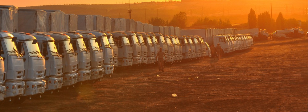 Trucks for a second humanitarian aid convoy to eastern Ukraine are parked in the Russian town of Donetsk on Saturday. Russia hopes to send the convoy to eastern Ukraine soon, but the border-crossing point is still undecided.