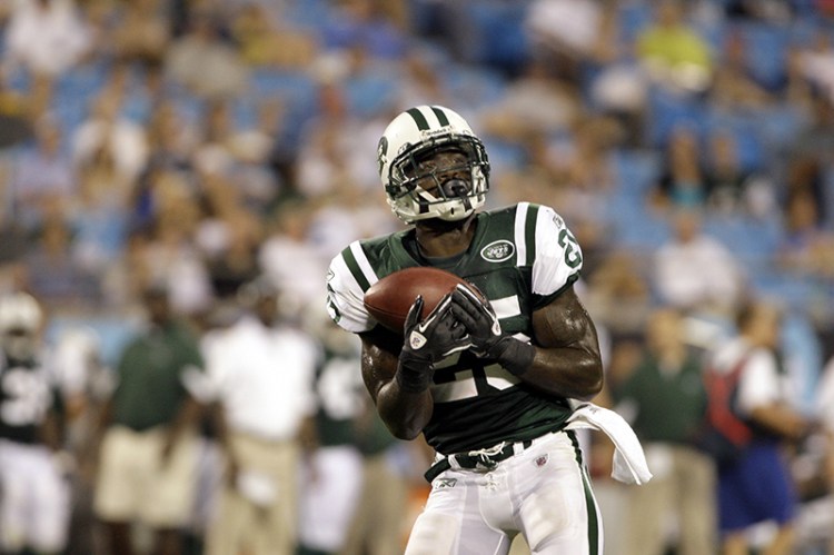 In this 2010 file photo, New York Jets punt returner Joe McKnight catches a punt as the Jets play the Carolina Panthers in an NFL preseason game in Charlotte, N.C. The Associated Press