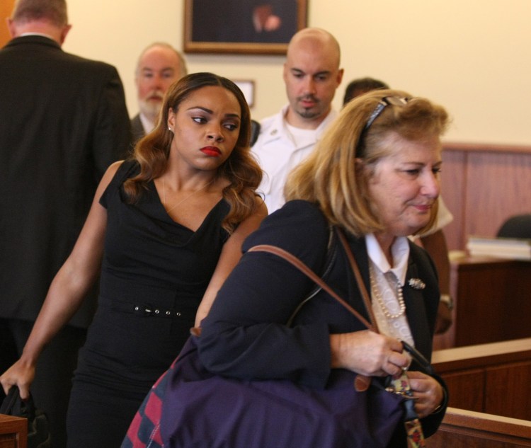 Shayanna Jenkins, left,   fiancee of accused murderer Aaron Hernandez, appears in court Friday seeking to have perjury charges against her dismissed.  Her attorney, Janice Bassil, is  on the right. The Associated Press