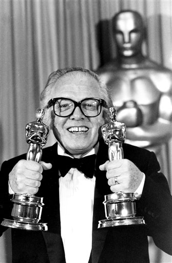 Richard Attenborough holds his two Oscars for his epic movie "Gandhi" at the 55th annual Academy Awards in Los Angeles, Calif., in 1983. The Associated Press