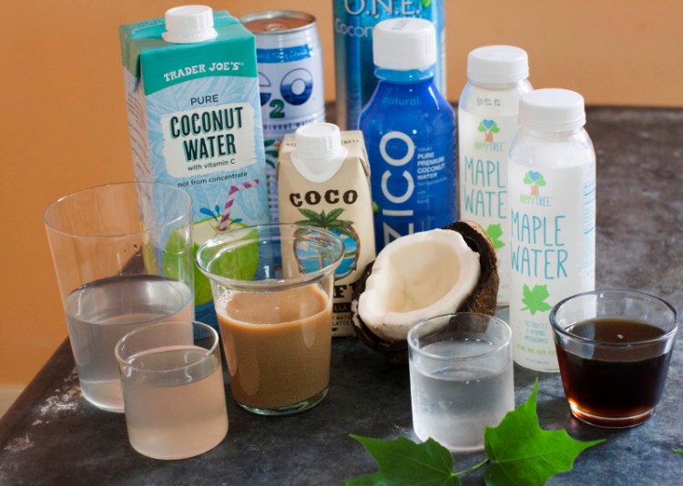 An assortment of trending waters, from left: Trader Joe's pure coconut water, C2O pure coconut water, Coco Cafe vanilla coconut water cafe latte, Zico pure premium coconut water, O.N.E. coconut water, and Happy Tree maple water and maple syrup.
