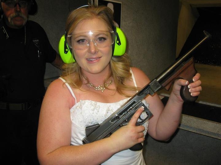 Lindsae MacDuff holds an automatic weapon at the Gun Store in Las Vegas after her "shotgun wedding." Such businesses up in Las Vegas offer bullet-riddled bachelor parties and literal shotgun weddings, where newly married couples can fire submachine gun rounds and pose with Uzis and ammo belts. The Associated Press