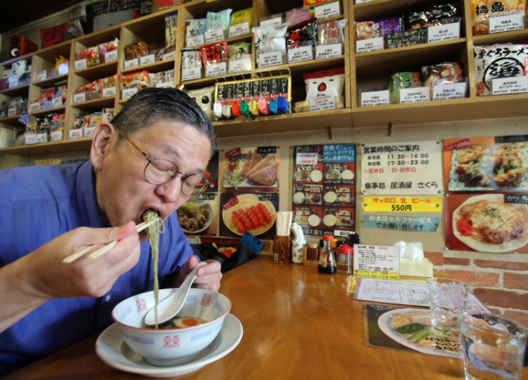 Japanese instant ramen noodle expert Masaya “Sokusekisai” Oyama, 55, slurps instant ramen noodle at a shop & restaurant specialized only in varieties of instant noodles in Tokyo. Oyama knows a lot about the instant noodle. He eats more than 400 instant noodles a year, and he usually goes by his nickname “Sokusekisai,” which means “instant.”　He agrees eating only instant noodles is not good for your health, because eating one thing all the time isn’t healthy, no matter what it is.