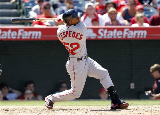 Red Sox outfielder Yoenis Cespedes hits a three-run home run against the Los Angeles Angels in the seventh inning Sunday in Anaheim, Calif. The Associated Press