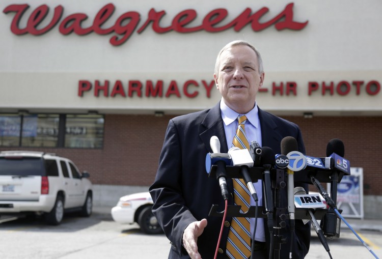 U.S. Sen. Dick Durbin, D-Ill., speaks during a news conference outside a Walgreen drugstore Wednesday in Chicago. Durbin praised Walgreen, the nation's largest drugstore chain, for declining to pursue an overseas reorganization to trim its U.S. taxes. The Associated Press