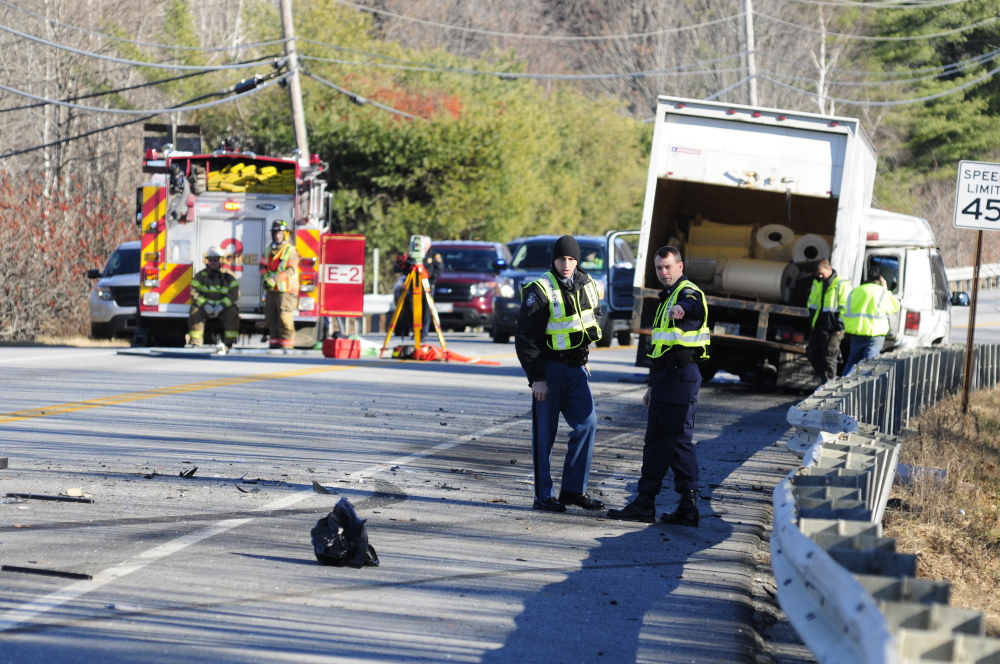 Emergency crews work at the scene of a collision near intersection of U.S. Route 202 and Royal Street on Nov. 21, 2013 in Winthrop. 