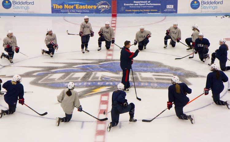 USA women’s hockey coach Ken Klee, a former Portland Pirates defenseman, addresses players at center ice during their evaluation camp at Harold Alfond Forum at the University of New England in Biddeford on Saturday. The team scrimmaged Friday and will also have intra-squad games Sunday and Monday.