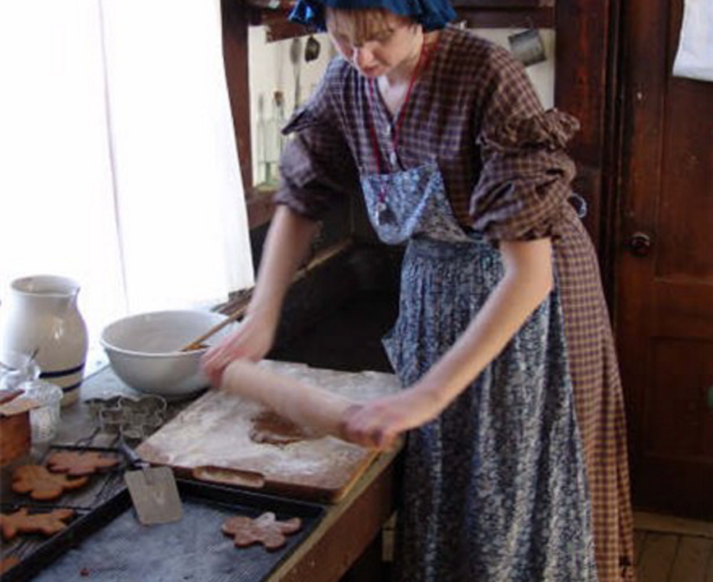 Anne Gibbs makes cookies in the Washburn-Norlands Living History Center’s kitchen. The center is now taking reservations for its annual 24-hour live-in history experience.