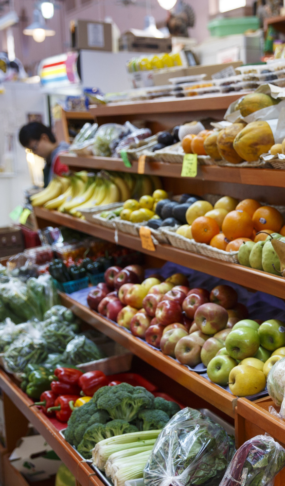 Fruits and vegetables are displayed for sale at a market in Washington. A 12-year study shows diet has improved in the U.S., but not among the poor.