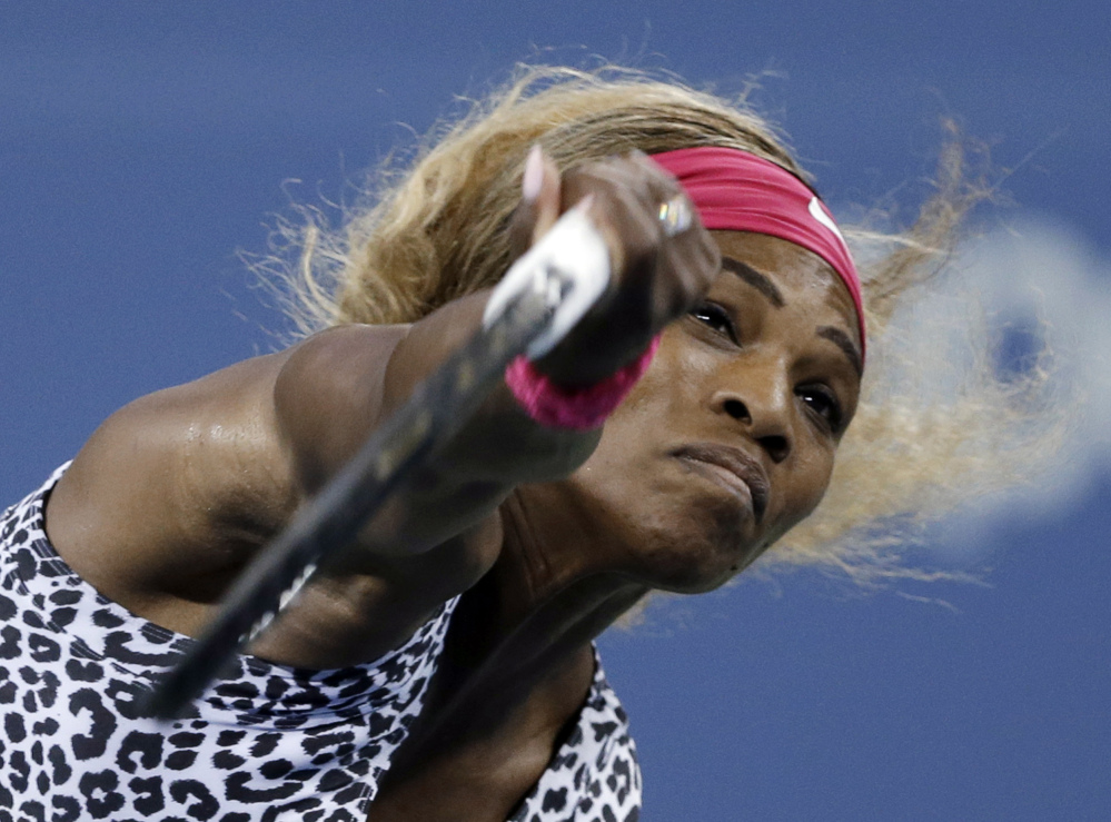 Serena Williams of the United States serves to Flavia Pennetta of Italy during their quarterfinal match at the U.S. Open tennis tournament Wednesdayin New York.