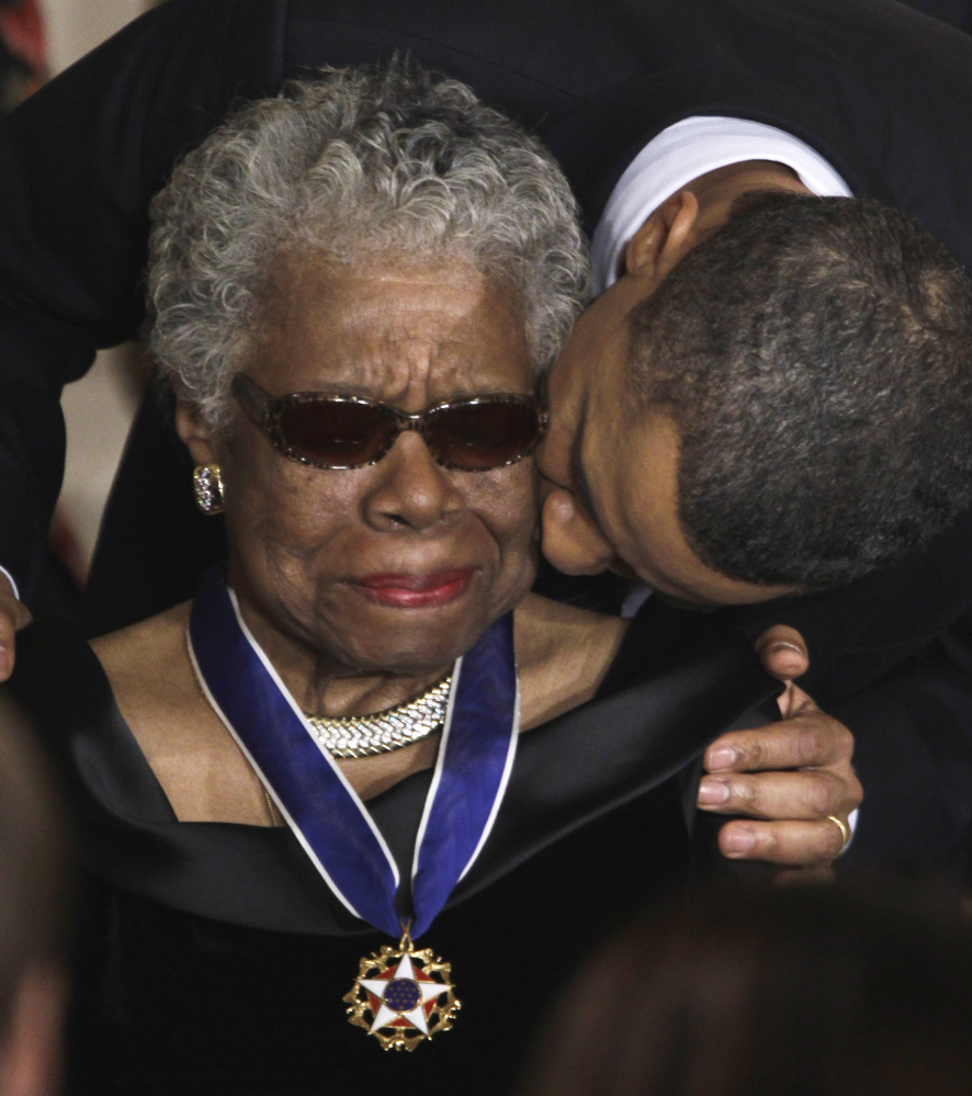 President Obama kisses Maya Angelou after awarding her the 2010 Medal of Freedom.