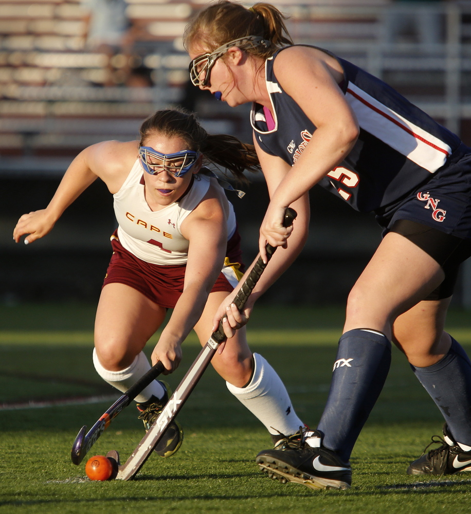 Makayla Pinette of Cape Elizabeth, left, tries to strip the ball from Skye Conley of visiting Gray-New Gloucester during the first half at Hannaford Field.
