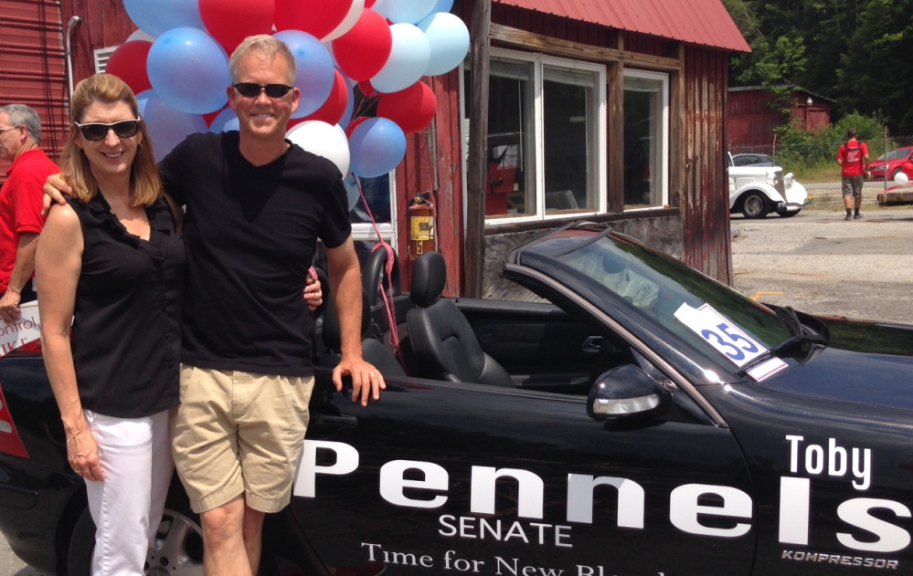 Toby Pennels is shown with his wife, Brenda, during a parade in Casco in July. Pennels died early Thursday from injuries suffered in a motorcycle accident last month.