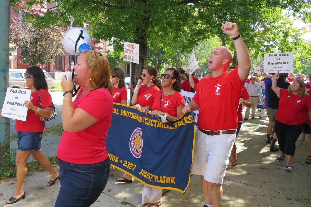 Members of the International Brotherhood of Electrical Workers march near Longfellow Square in Portland on Monday to call for FairPoint Communications to return to the negotiating table. The company, which provides telephone service in Maine, New Hampshire and Vermont, declared an impasse last week after four months of negotiations with two unions.