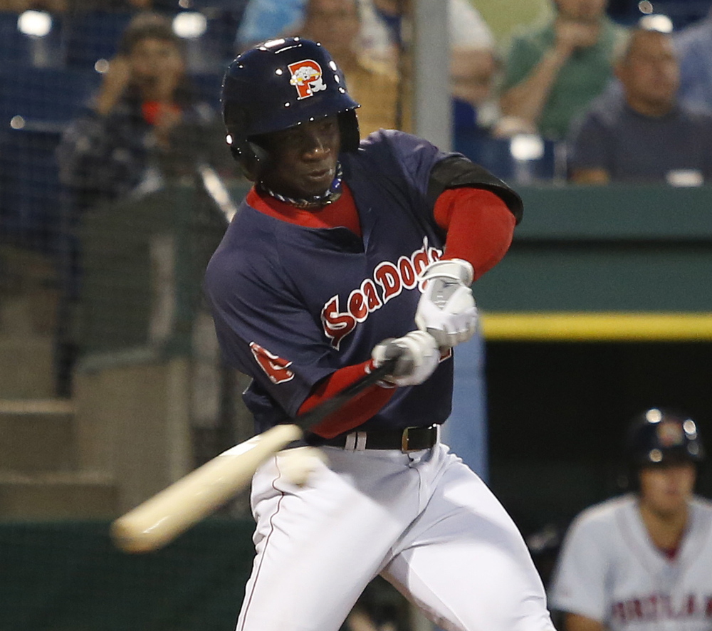 Rusney Castillo of Portland lines a double in the fifth inning of Game 3 of the playoff series against Binghamtom. Derek Davis/Staff Photographer