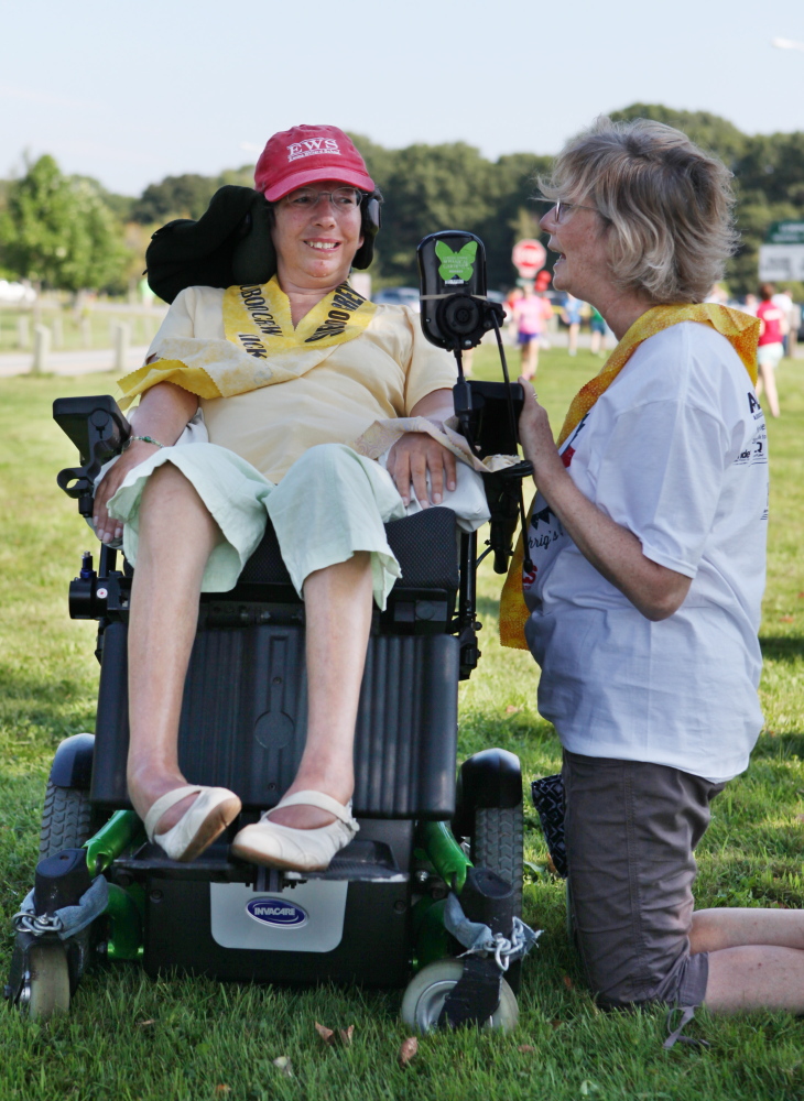 Lesley Sneddon, of Newton, Mass., speaks with friend Sue Gawler on Saturday before the start of the Walk to Defeat ALS in Portland. Gawler has had ALS for four years and has raised over $10,000 for research efforts.