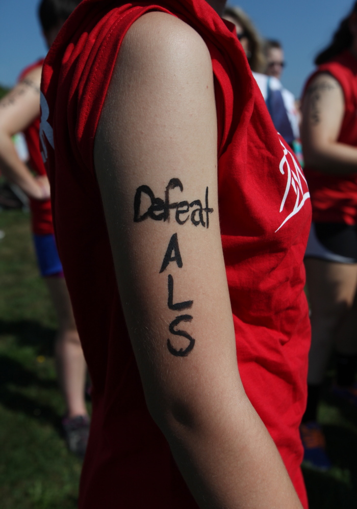 PORTLAND, ME - SEPTEMBER 6: "Defeat ALS" is seen painted on the arm of Gabrielle Fenton, of Cumberland, Saturday, Sept. 6, 2014 before the start of the Walk to Defeat ALS in Portland, Maine. (Photo by Joel Page/Staff Photographer)