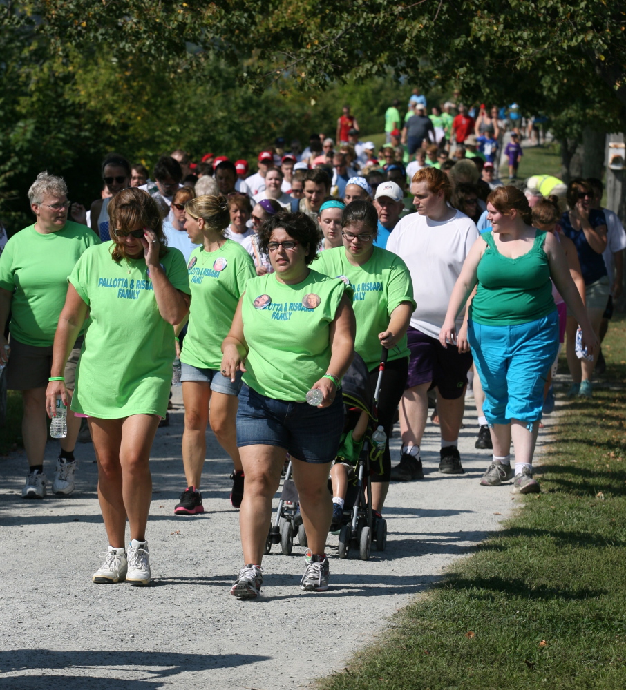 Participants walk around Back Cove on Saturday during the Walk to Defeat ALS.