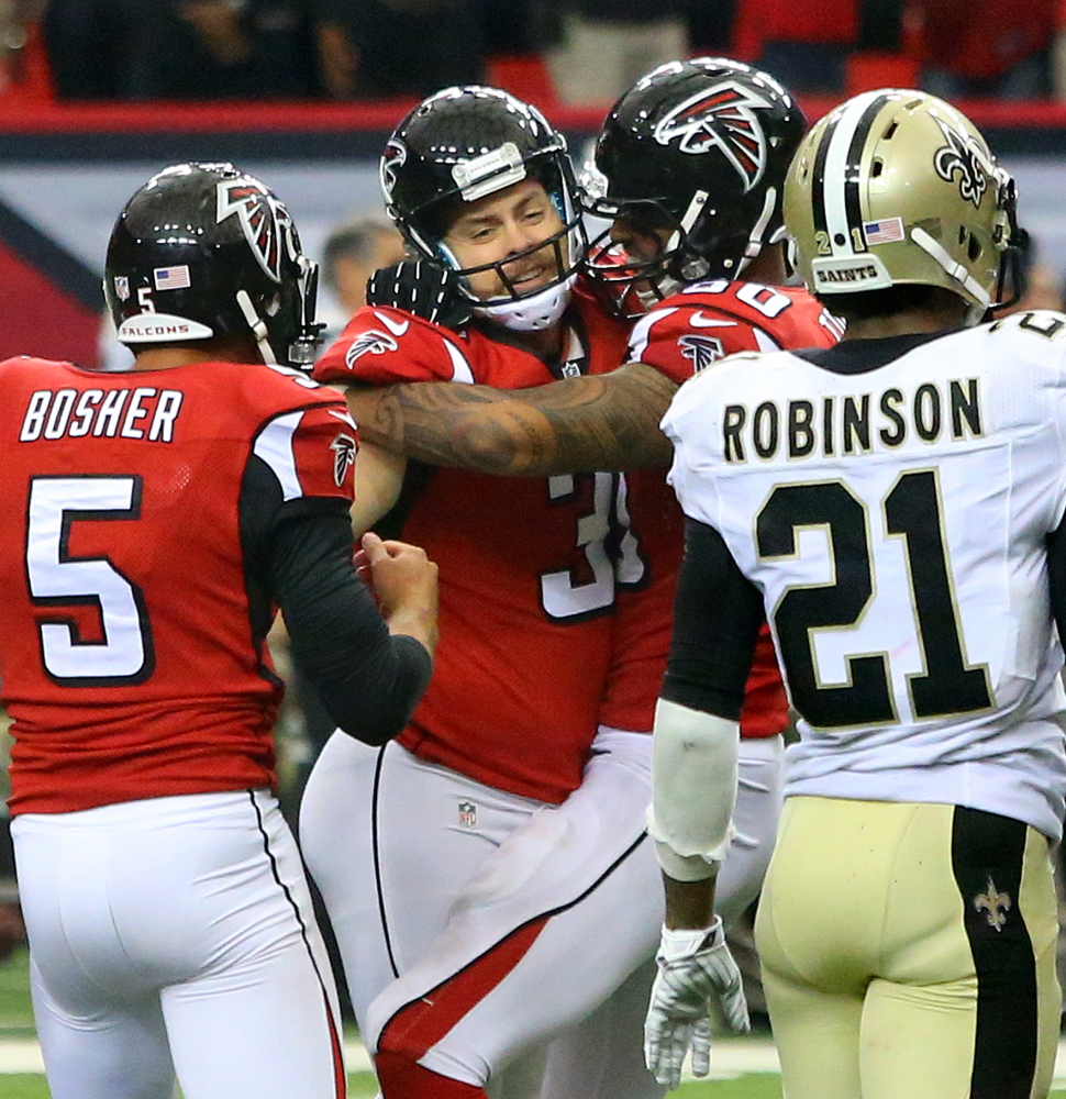 Matt Bryant, second from left, celebrates with teammates after his 52-yard field goal in overtime Sunday gave the Atlanta Falcons a 37-34 win over the New Orleans Saints.