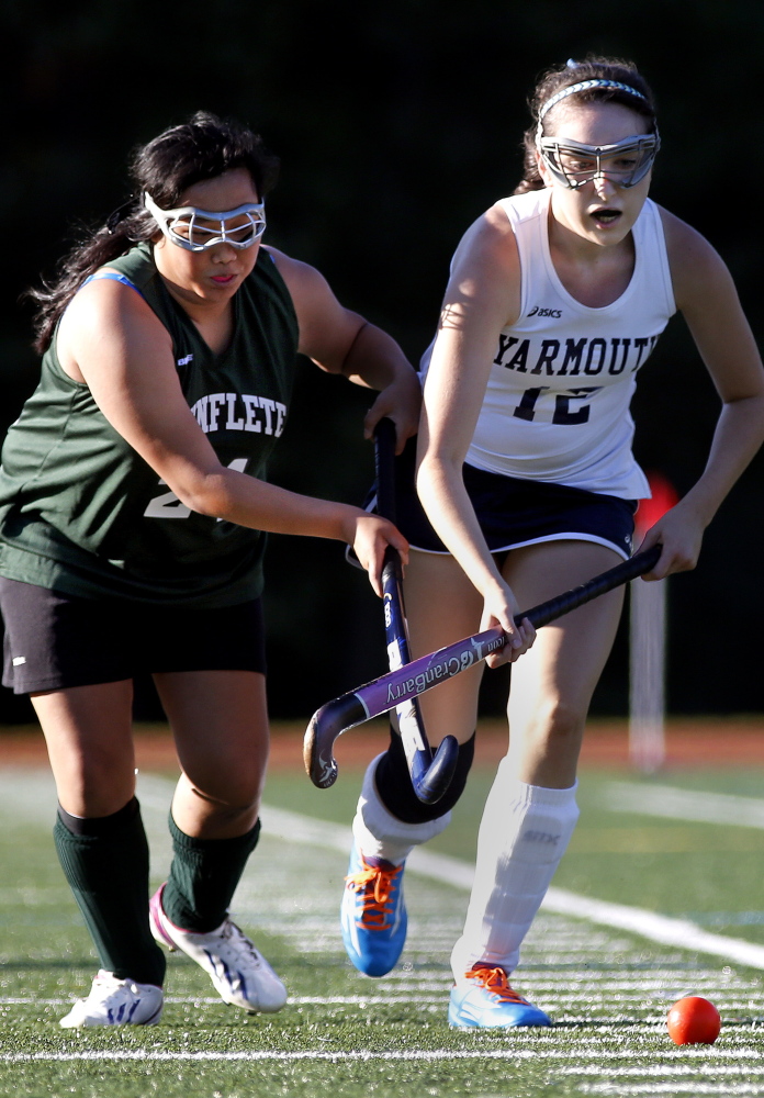Waynflete’s Eliza Cox and Yarmouth’s Fiona Clarke battle for control of the ball during the Clippers’ 7-0 win Monday afternoon in Yarmouth.