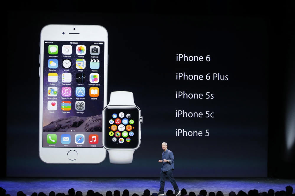 Apple CEO Tim Cook speaks during an Apple event announcing the iPhone 6 and the Apple Watch in Cupertino, Calif., on Monday.