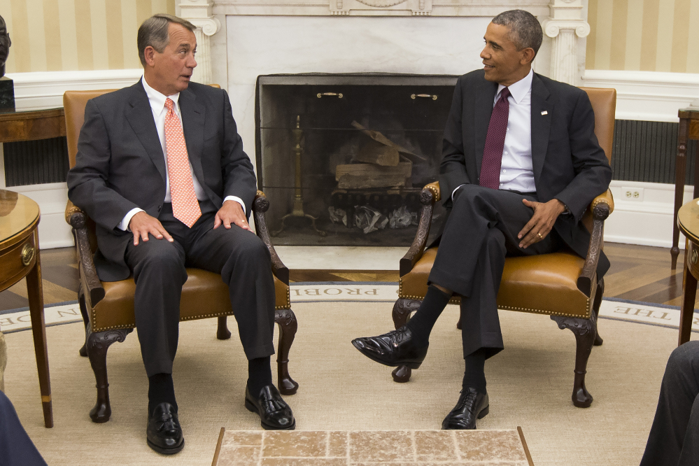 President Obama talks with House Speaker John Boehner of Ohio in the Oval Office on Tuesday as the president meets with congressional leaders to discuss options for combating the Islamic State.

The Associated Press