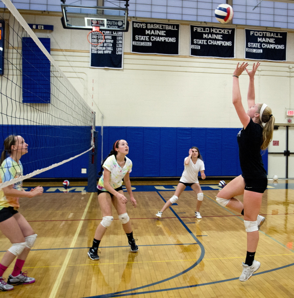 Yarmouth is one of just two Class B teams in southern Maine and must travel Down East to face the competition they will see in the playoffs. But the Clippers make the long trips work for them. During a recent Yarmouth practice Alison Clark goes up for a return.