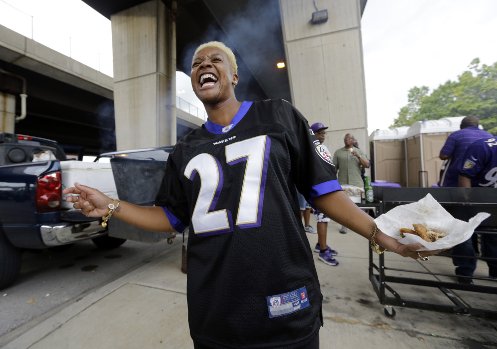 Karla Owens wears a Baltimore Ravens Ray Rice jersey as she tailgates before the Ravens’ game against the Pittsburgh Steelers on Thursday night in Baltimore.