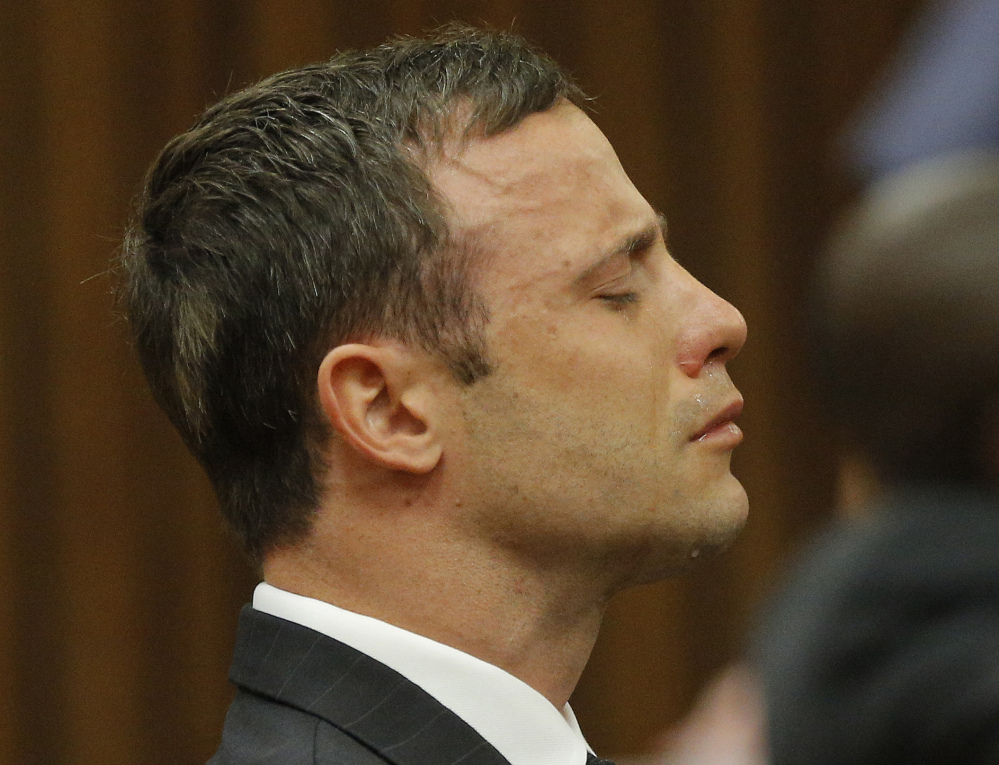 Oscar Pistorius reacts as Judge Thokozile Masipa rules out a murder conviction in this Sept. 11, 2014, photo. On Thursday, Justice Lorimer Eric Leach of the Supreme Court of Appeal delivered a ruling  that Pistorius "ought to have been found guilty of murder on the basis that he had fired the fatal shots with criminal intent." 
