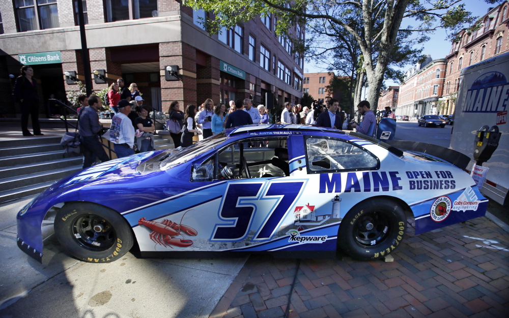 A race car being billed as the “Maine Open for Business Chevrolet,” is introduced tot he public Friday in Portland. The marketing slogan was introduced by Maine Gov. Paul LePage. The high-speed billboard for Maine was partially funded by taxpayers. The Associated Press/Robert F. Bukaty)