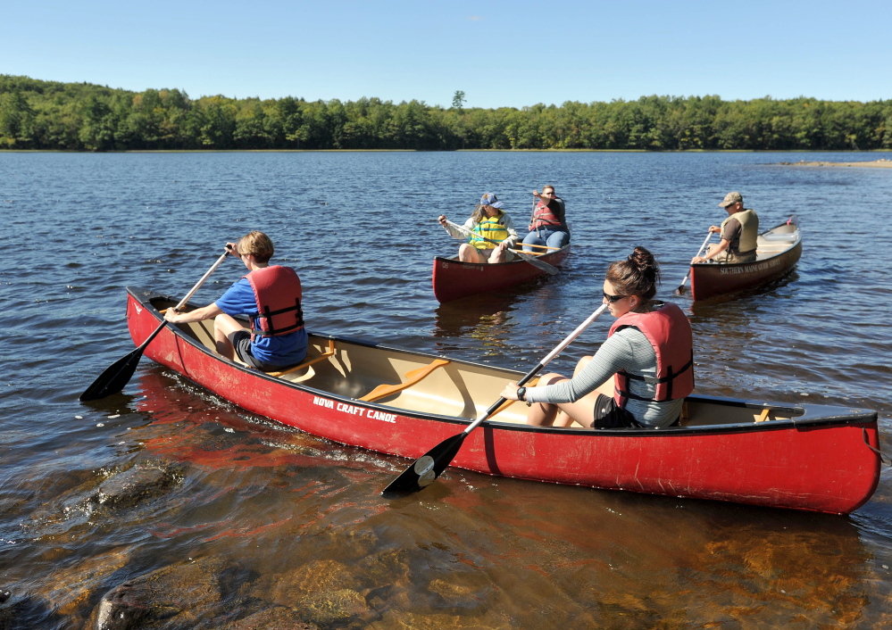 Participants in the Becoming an Outdoors Woman in Maine program try their hand at canoeing Friday. “It’s important for everyone to have a connection to the outdoors, especially since we live in Maine,” said Emily MacCabe, a state outreach coordinator.