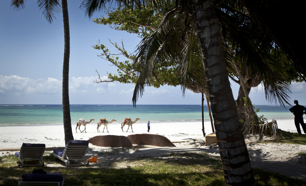 A man offering camel rides for tourists leads his animals along the Indian Ocean beach of Diani, a popular tourist destination on the coast of Kenya. Ebola is thousands of miles away from Kenya’s pristine Indian Ocean beaches but the deadly disease appears to be discouraging tourism there and elsewhere in this vast continent, with tour operators across Africa saying they face difficulties.