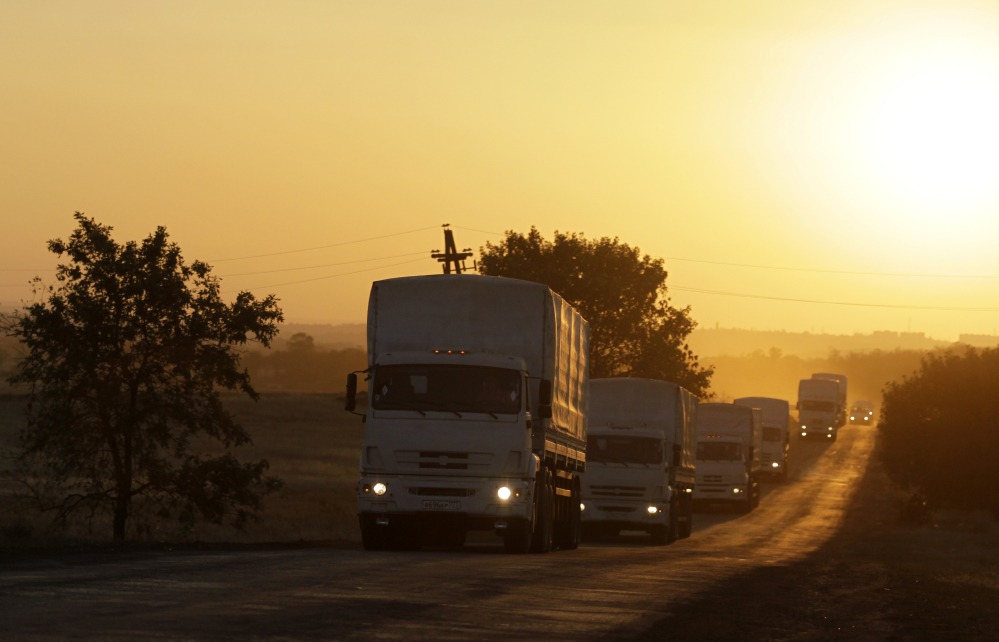 A Russian aid convoy heads back toward Russia on Saturday near the border post at Izvaryne, eastern Ukraine. More than 200 trucks carried humanitarian supplies to Luhansk.