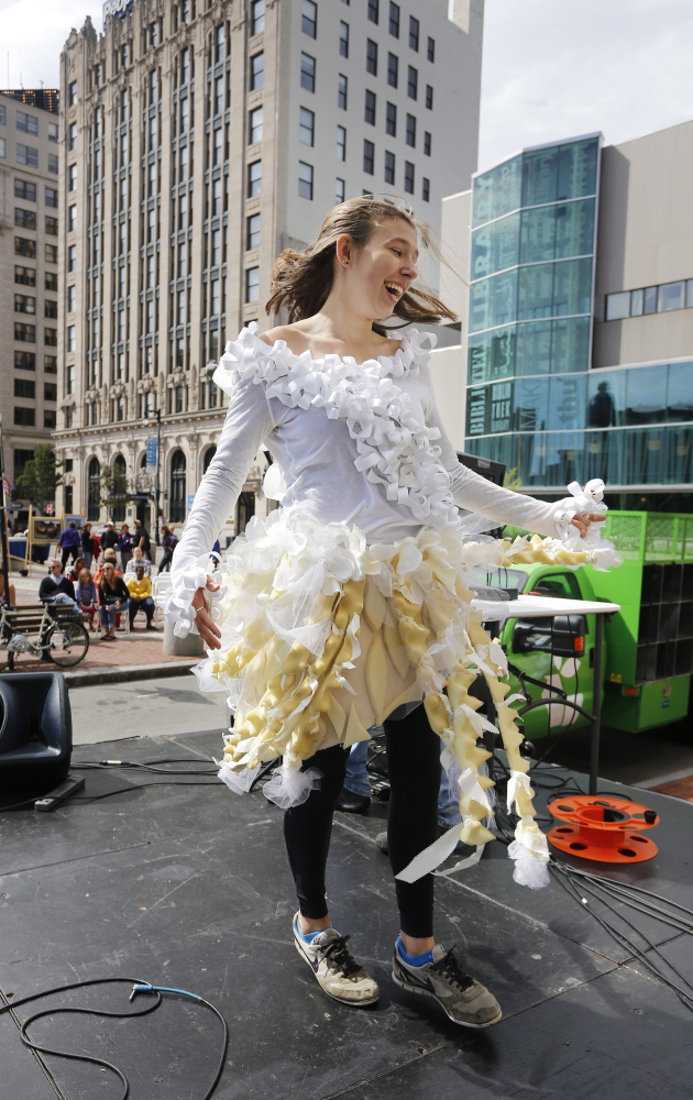 Kate Burgess, a freshman at the University of New England, takes the stage wearing an outfit made of recycled materials during an eco-fashion show Saturday as part of the first Portland Greenfest. Burgess, of Chelmsford, Mass., is majoring in environmental science.