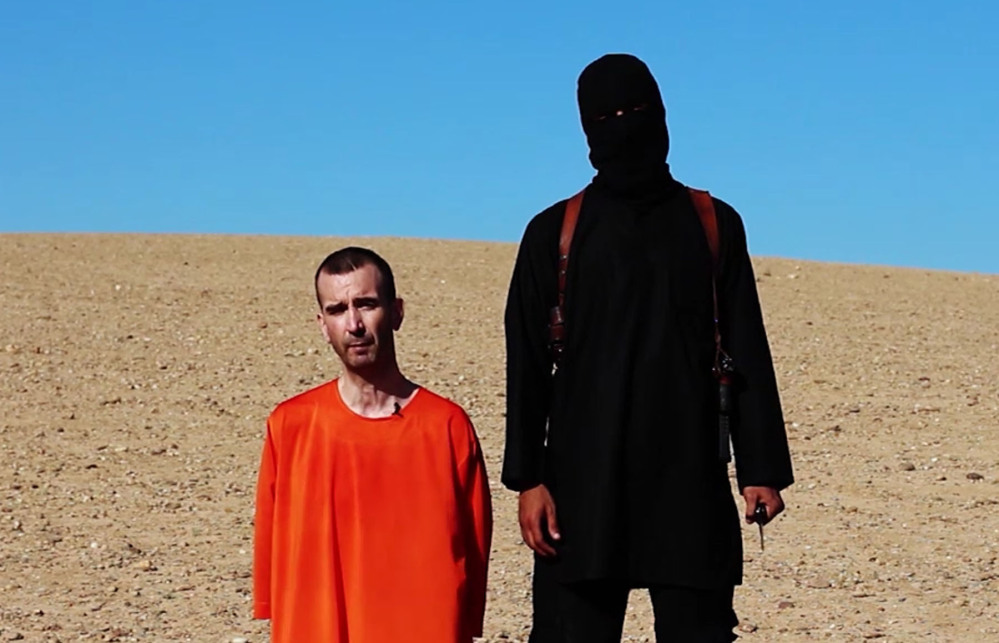 This image made from video posted on the Internet by Islamic State militants and provided by the SITE Intelligence Group, a U.S. terrorism watchdog, on Saturday, purports to show British aid worker David Haines before he was beheaded.