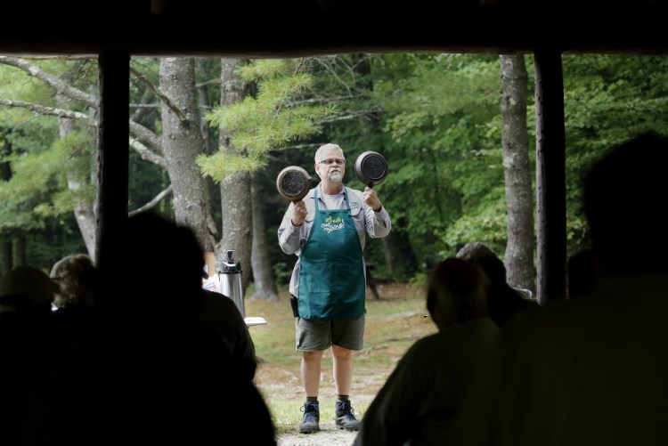 :Fritz Appleby, park manager at Bradbury Mountain State Park, gives a lecture on the care and use of cast-iron cookware. Derek Davis/Staff Photographer