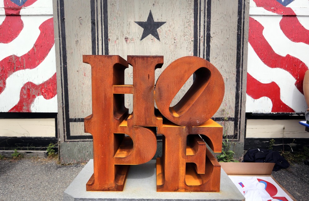 A steel version of Robert Indiana’s HOPE sculpture is displayed outside his home on the first International HOPE Day, his 86th birthday, Saturday on Vinalhaven Island.