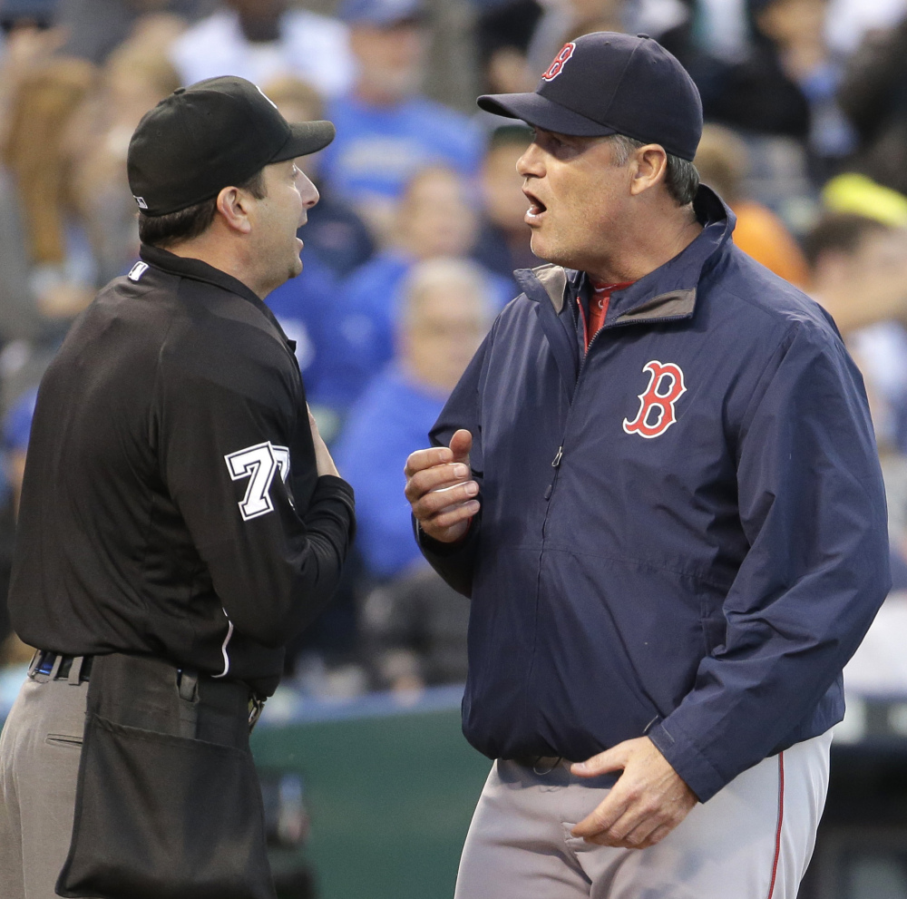 Red Sox Manager John Farrell argues with home plate umpire Jim Reynolds after a balk was called on Red Sox pitcher Rubby De La Rosa against Kansas City on Saturday.