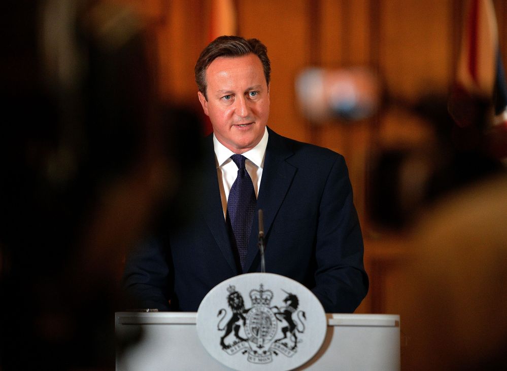 Britain’s Prime Minister, David Cameron, makes a statement to the media on the killing of British aid worker David Haines in Downing Street, central London, Sunday. In an emotional statement after chairing a meeting of the Government’s Cobra emergency committee to discuss the killing, he hailed David Haines as a “British hero” and vowed to “hunt down those responsible and bring them to justice no matter how long it takes.”