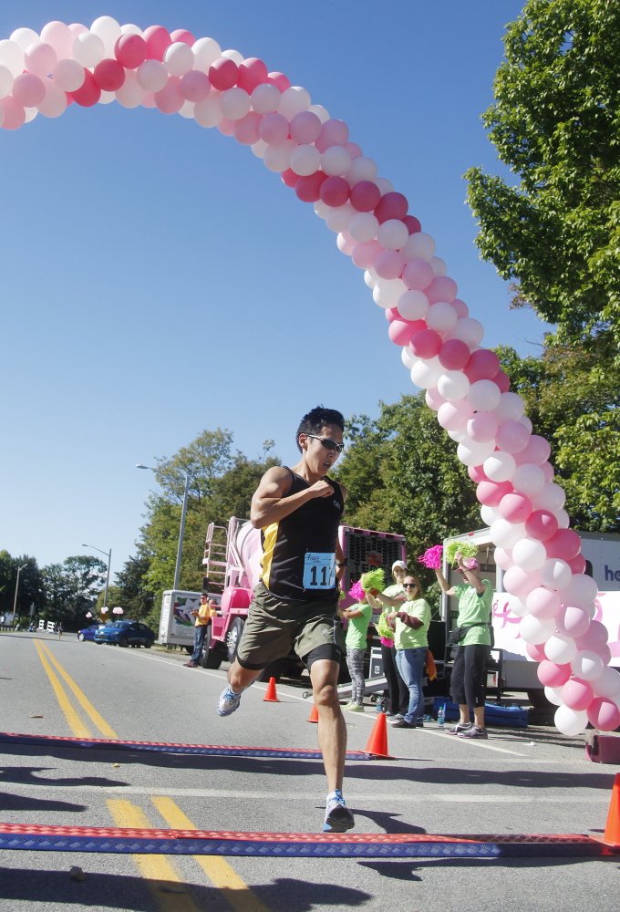 Jill Brady/Staff Photographer
Zach Boyce of Portland is the first finisher in the Race for the Cure on Back Cove in Portland on Sunday.