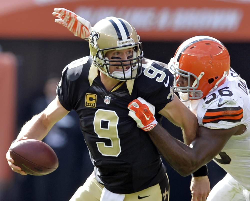 Browns linebacker Karlos Dansby sacks Saints quarterback Drew Brees during Cleveland’s 26-24 win Sunday – the Browns’ first victory in a home opener since 2004.