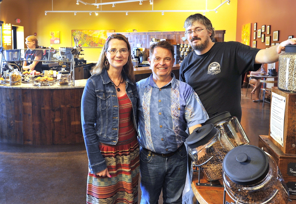 From left, Coffee By Design owners Mary Allen Lindemann and Alan Spear and head roaster Dylan Hardman are shown in their new place of business at 1 Diamond St. in Portland.