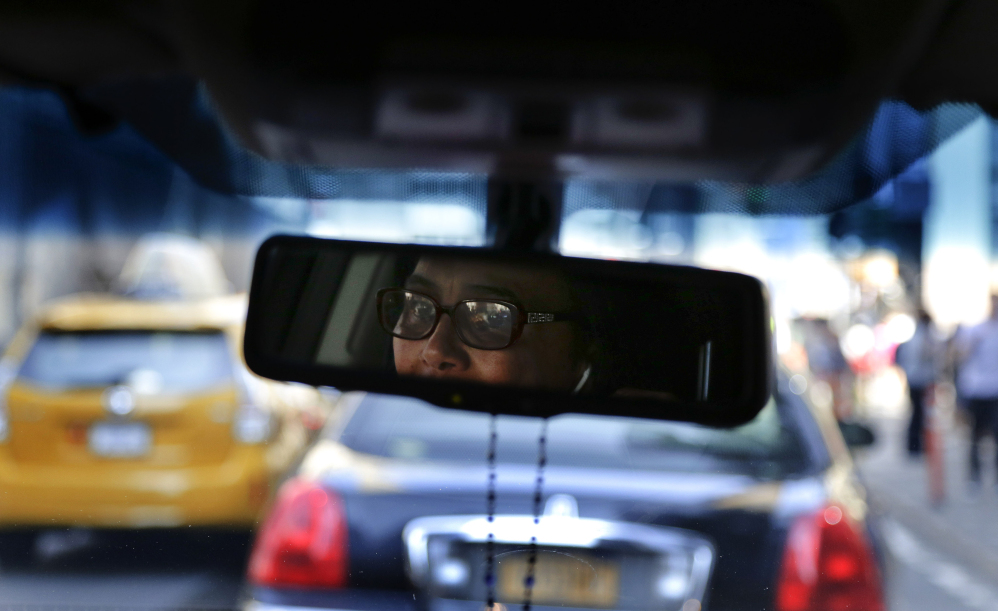 Dinorah De Cruz drives through Manhattan on her way to the SheRide livery office in Queens on Monday. De Cruz is one of 100 women currently signed up to drive for SheRides, a car service by women drivers for women riders in New York City, Westchester County and Long Island. Less than 3 percent of the city’s 115,000 licensed taxi, livery and limousine drivers are women, and that can be a problem for women who are reluctant to get into a cab alone with a male driver because of safety concerns or religious and social mores.