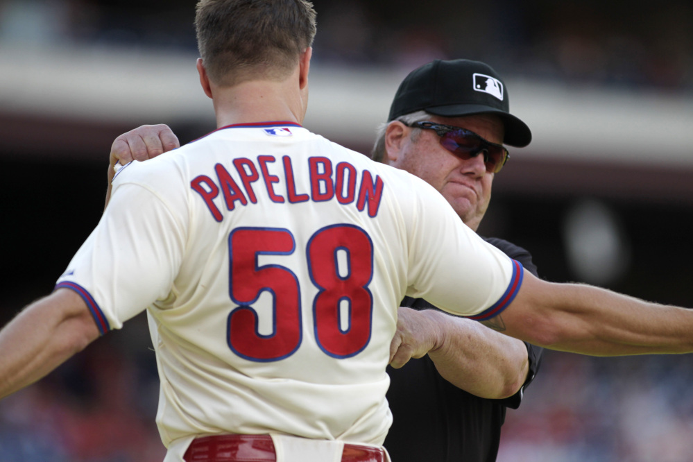 Philadelphia Phillies pitcher Jonathan Papelbon argues with umpire Joe West after being ejected from the game against the Miami Marlins in the ninth inning Sunday in Philadelphia. The Marlins won 5-4.