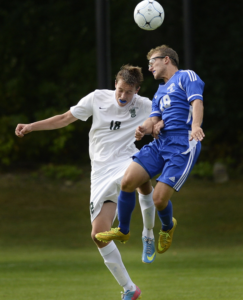 Luke Velas of Falmouth, right, heads the ball past Christian Brooks of Waynflete during their Western Maine Conference boys’ soccer game Tuesday in Portland. Falmouth improved its record to 2-0-2 with a 1-0 victory. Waynflete is 2-1.