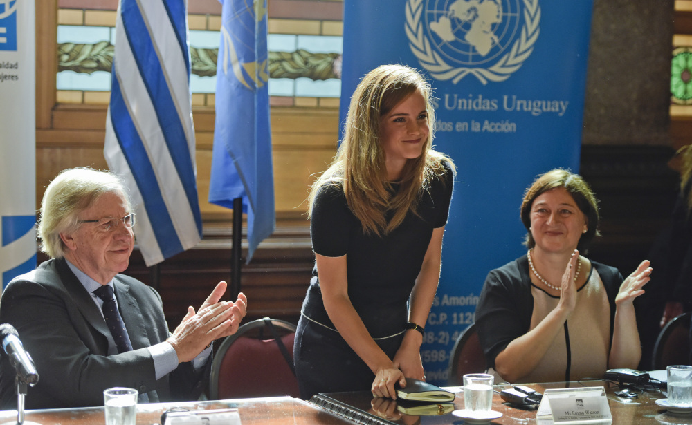 Uruguay's Vice President Danilo Astori, left, and director of U.N. Women Gulden Turkoz, right, applaud after a speech by Emma Watson, U.N. Women goodwill ambassador, at Parliament in Montevideo, Uruguay, on Wednesday. 