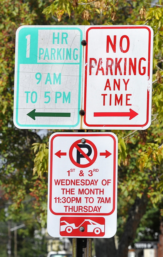 PORTLAND, ME - SEPTEMBER 17: Parking signs on Bracket St. in West End causing confusion with car owners. (Photo by Gordon Chibroski/Staff Photographer)
