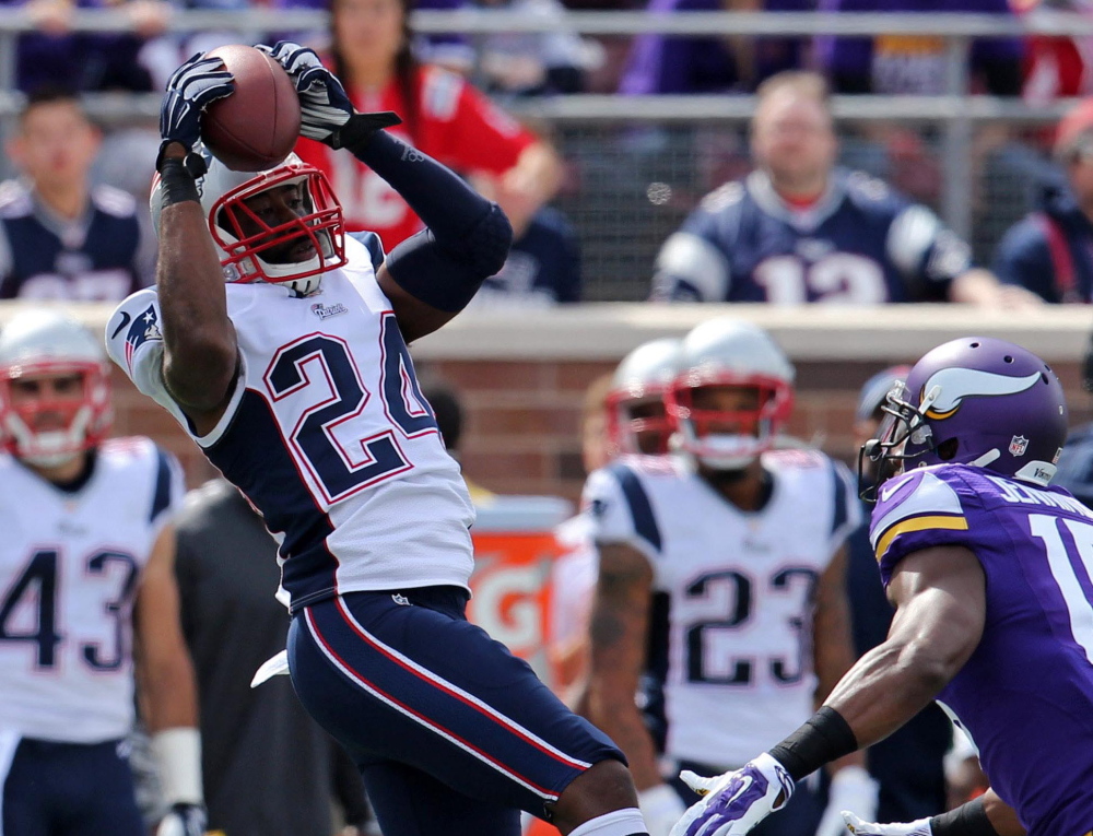 Cornerback Darrelle Revis, left, made his first interception as a Patriot in last Sunday’s 30-7 victory over the Vikings.
